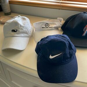 Lot of 4 hats, only one is kid sized is Nike size 4-7 for kids